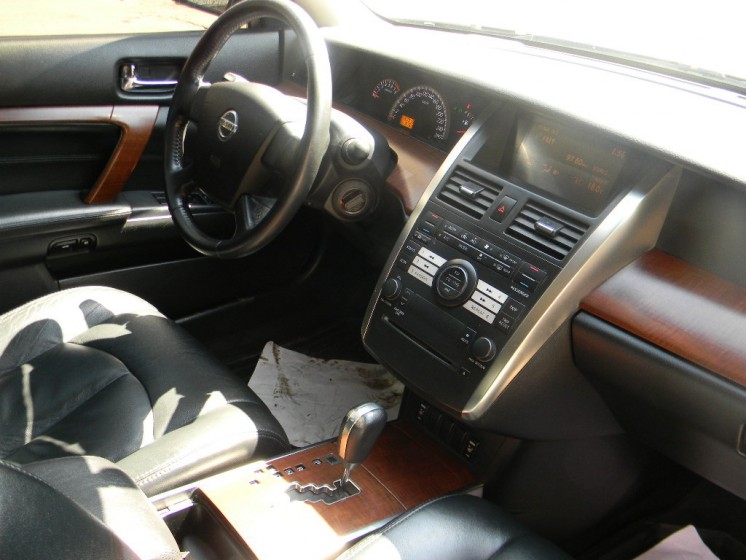 Фото Nissan Teana. Панель, руль, консоль и передние сиденья